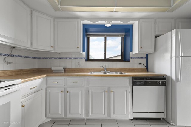 9199 N Rd Unit E, Palos Hills, IL 60465 - kitchen featuring white appliances, white cabinetry, and decorative backsplash