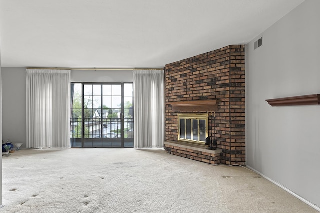 9199 N Rd Unit E, Palos Hills, IL 60465 - unfurnished living room featuring a brick fireplace and carpet