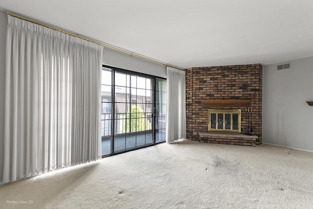 9199 N Rd Unit E, Palos Hills, IL 60465 - unfurnished living room featuring carpet floors and a brick fireplace
