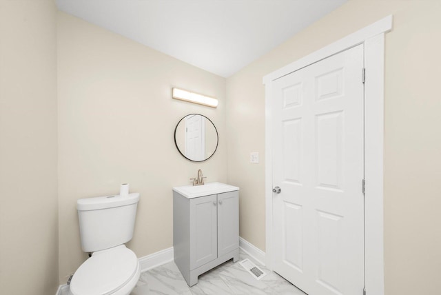 half bath featuring vanity, visible vents, marble finish floor, toilet, and baseboards
