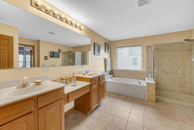 full bathroom with a sink, a shower stall, a bath, and tile patterned floors