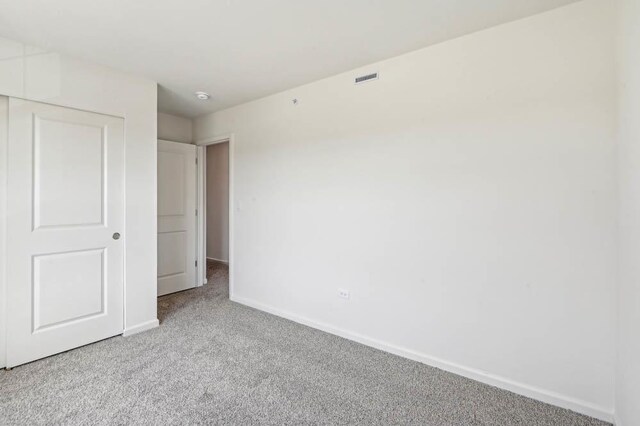 6341 Ulster Dr, Tinley Park, IL 60477 - unfurnished bedroom featuring carpet floors, baseboards, a closet, and visible vents