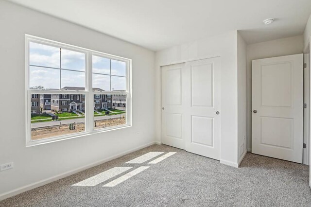 6341 Ulster Dr, Tinley Park, IL 60477 - unfurnished bedroom featuring carpet floors, baseboards, and a closet