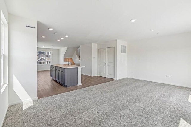 6341 Ulster Dr, Tinley Park, IL 60477 - unfurnished living room featuring dark colored carpet, recessed lighting, baseboards, and visible vents