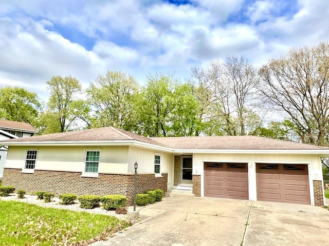 view of front of home with brick siding, an attached garage, driveway, and roof with shingles