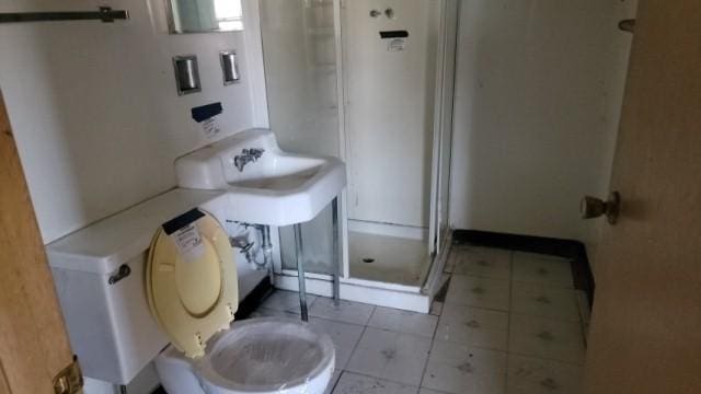 3306 Hazel Ln, Hazel Crest, IL 60429 - full bathroom featuring toilet, tile patterned floors, and a stall shower