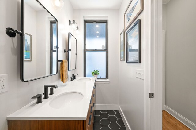 1610 N Whipple St Unit 2, Chicago, IL 60647 - bathroom with baseboards and double vanity