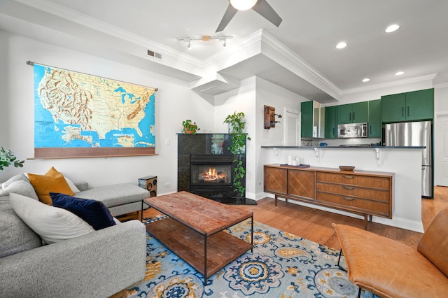 1610 N Whipple St Unit 2, Chicago, IL 60647 - living room featuring crown molding, wood finished floors, recessed lighting, a ceiling fan, and baseboards