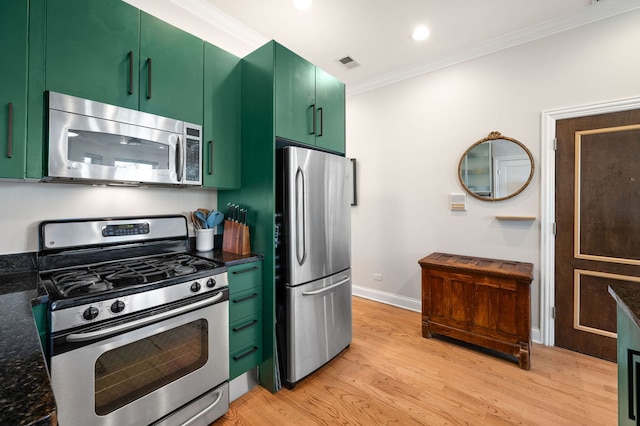 1610 N Whipple St Unit 2, Chicago, IL 60647 - kitchen featuring stainless steel appliances, green cabinetry, crown molding, light wood-type flooring, and baseboards