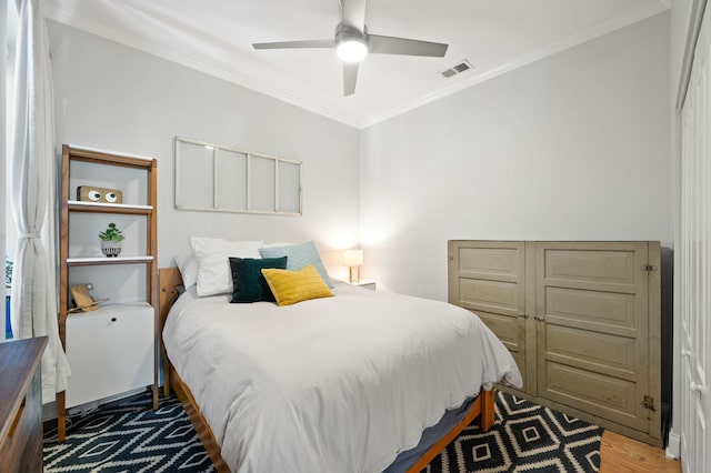 1610 N Whipple St Unit 2, Chicago, IL 60647 - bedroom featuring ornamental molding, wood finished floors, and a ceiling fan