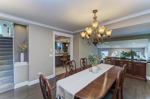 221 8th St, Downers Grove, IL 60515 - dining room with dark wood-type flooring, a chandelier, crown molding, stairs, and baseboards