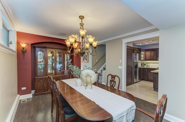 221 8th St, Downers Grove, IL 60515 - dining area featuring baseboard heating, a chandelier, stairs, light wood-type flooring, and baseboards