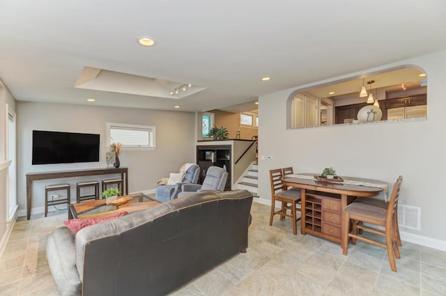 221 8th St, Downers Grove, IL 60515 - living area featuring recessed lighting, baseboards, stairs, and a raised ceiling