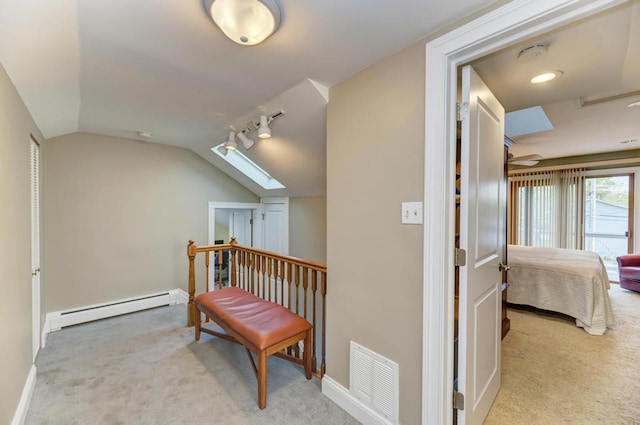 221 8th St, Downers Grove, IL 60515 - corridor with baseboard heating, carpet, lofted ceiling, baseboards, and a skylight