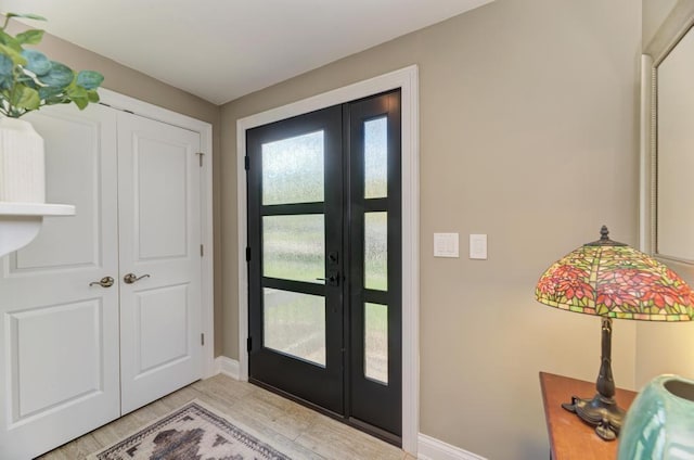 221 8th St, Downers Grove, IL 60515 - entryway featuring baseboards and light wood-type flooring