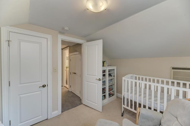 221 8th St, Downers Grove, IL 60515 - bedroom with vaulted ceiling, baseboards, carpet floors, and a wall unit AC