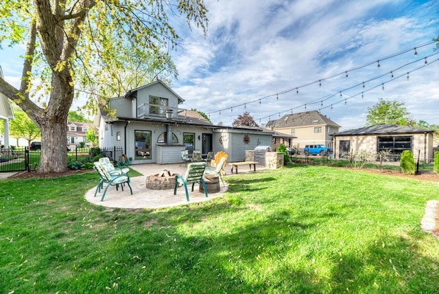 221 8th St, Downers Grove, IL 60515 - back of property featuring an outdoor fire pit and a patio