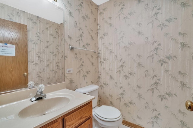 25056 Madison St, Plainfield, IL 60544 - bathroom featuring wallpapered walls, vanity, and toilet