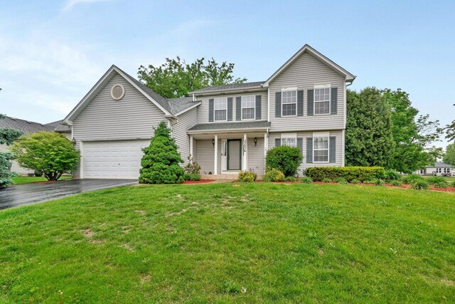 25056 Madison St, Plainfield, IL 60544 - view of front of home featuring driveway, a garage, a front yard, a porch, and a shingled roof