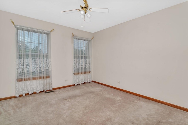 25056 Madison St, Plainfield, IL 60544 - unfurnished room with healthy amount of natural light, carpet, baseboards, and a ceiling fan