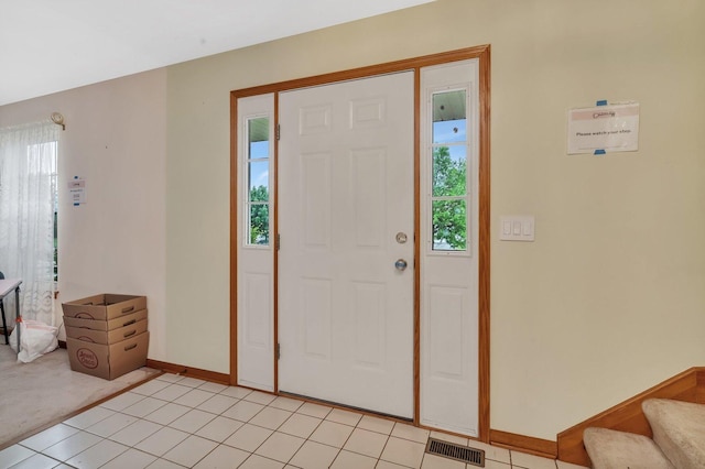 25056 Madison St, Plainfield, IL 60544 - entrance foyer featuring plenty of natural light, baseboards, light tile patterned flooring, and stairway