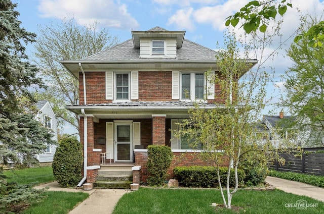 811 W Galena Blvd, Aurora, IL 60506 - traditional style home with covered porch, brick siding, and a shingled roof
