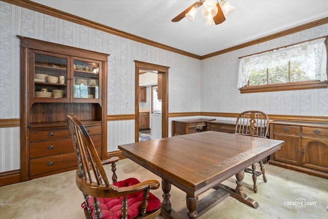811 W Galena Blvd, Aurora, IL 60506 - dining area featuring wallpapered walls, light carpet, a wainscoted wall, and ceiling fan