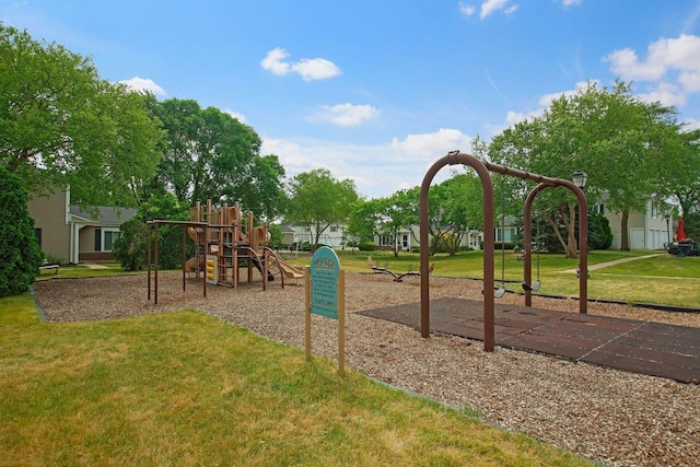 communal playground featuring a lawn