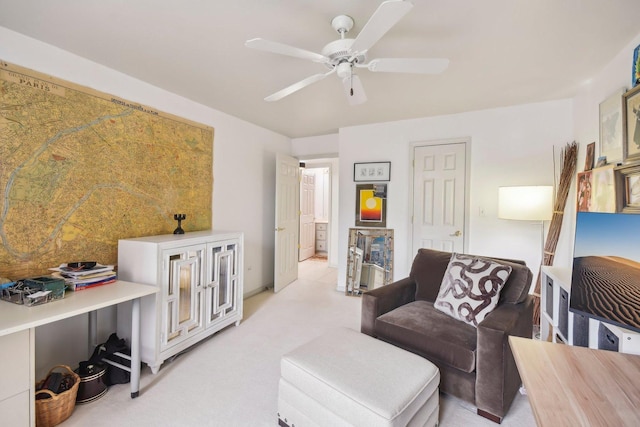 living room with a ceiling fan and light carpet