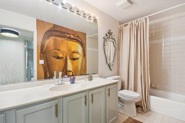 bathroom featuring tile patterned flooring, toilet, shower / tub combo with curtain, and vanity