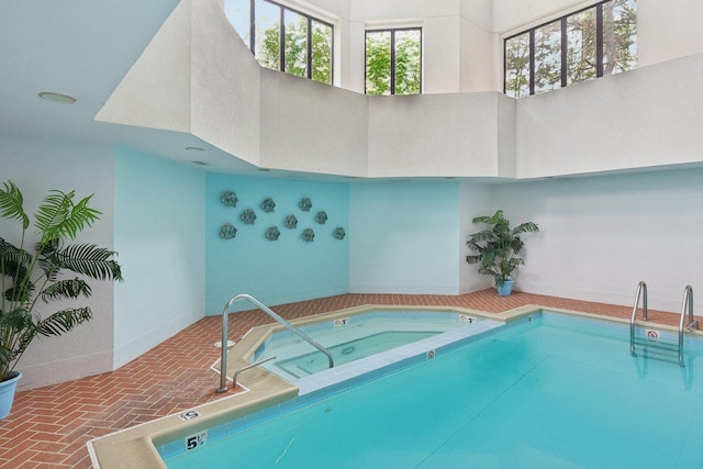 indoor pool with an in-ground hot tub