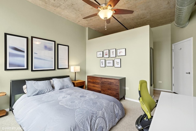 carpeted bedroom with baseboards and ceiling fan