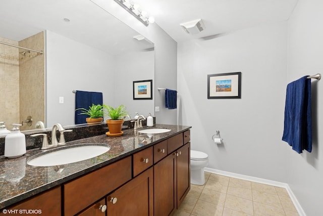 full bath featuring toilet, baseboards, double vanity, tile patterned floors, and a shower