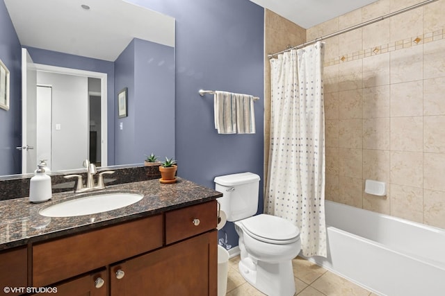 full bathroom featuring toilet, tile patterned floors, vanity, and shower / tub combo with curtain