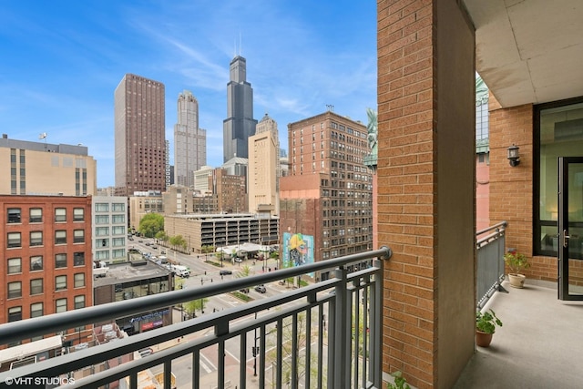 balcony featuring a skyline view