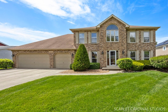 view of front of home with brick siding, a front lawn, concrete driveway, and a garage