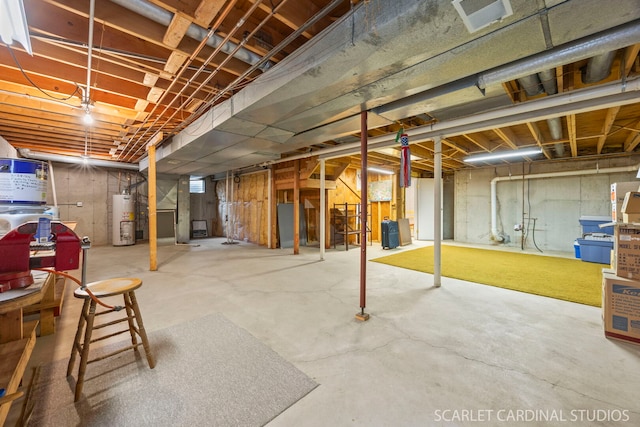 unfinished basement featuring gas water heater