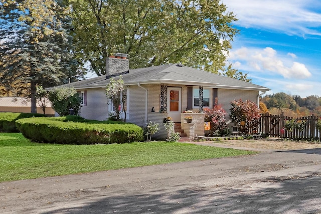 22345 W N Ave, Antioch, IL 60002 - ranch-style home with brick siding, fence, a chimney, and a front lawn