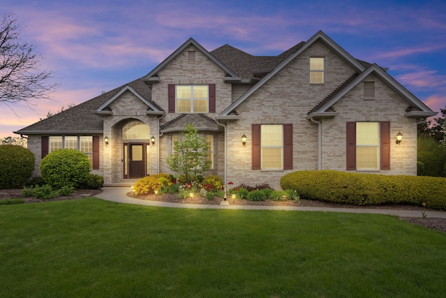 40W434 Triple Oaks Farm Dr, Hampshire, IL 60140 - view of front of home featuring a front yard, brick siding, and roof with shingles