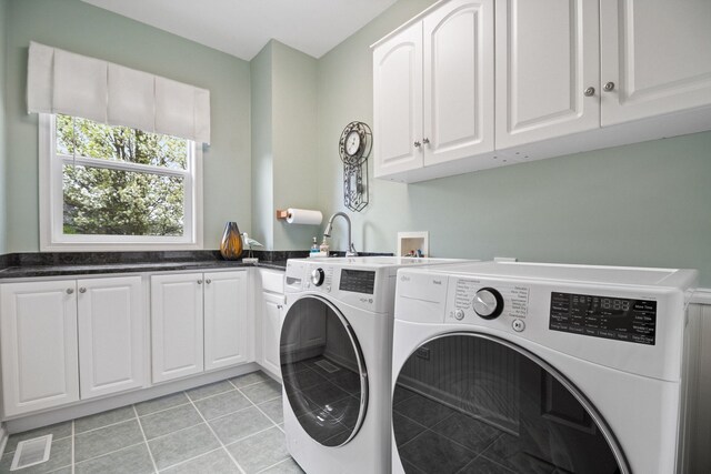 40W434 Triple Oaks Farm Dr, Hampshire, IL 60140 - clothes washing area featuring washer and clothes dryer, cabinet space, and light tile patterned floors