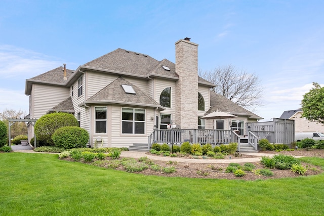 40W434 Triple Oaks Farm Dr, Hampshire, IL 60140 - rear view of property featuring a chimney, a yard, a wooden deck, and roof with shingles