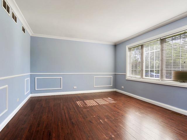 15535 Homan Ave, Markham, IL 60428 - spare room featuring hardwood / wood-style flooring and ornamental molding