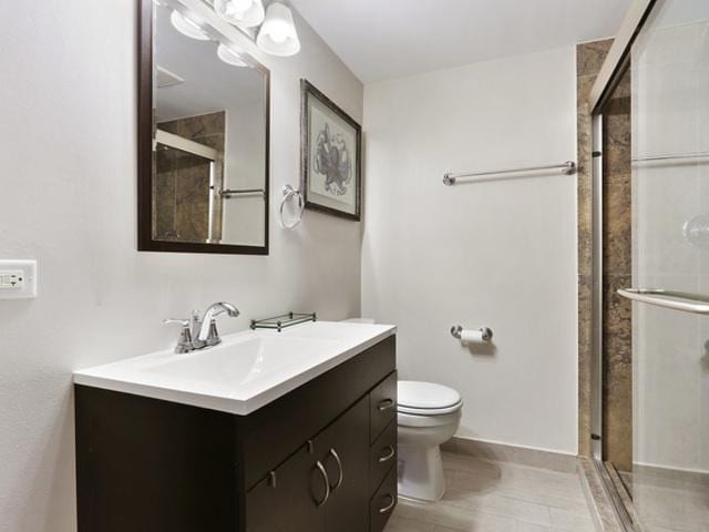 15535 Homan Ave, Markham, IL 60428 - bathroom with vanity and a stall shower