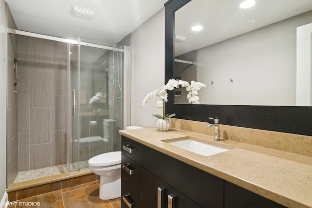 full bathroom featuring visible vents, a shower stall, vanity, toilet, and recessed lighting