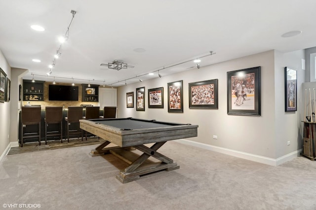 rec room featuring light colored carpet, rail lighting, indoor wet bar, baseboards, and billiards