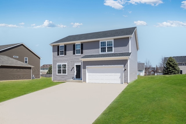view of front of home with a garage, driveway, and a front yard