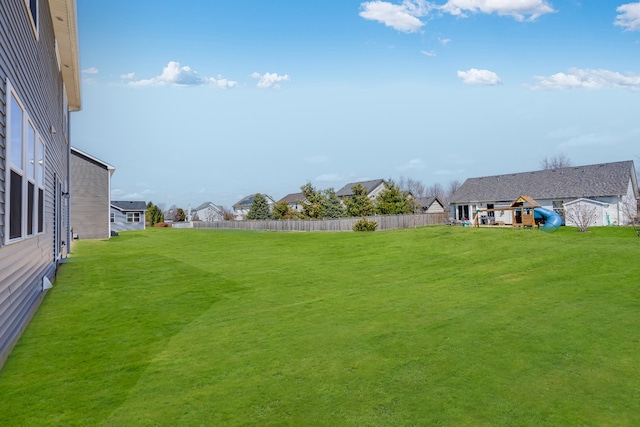 view of yard with fence and a residential view