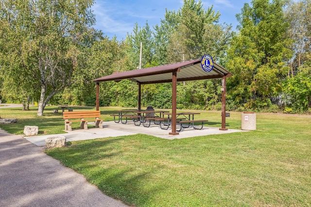 surrounding community with a yard and a gazebo