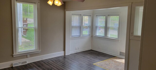 unfurnished dining area with visible vents, baseboards, ceiling fan, and a healthy amount of sunlight