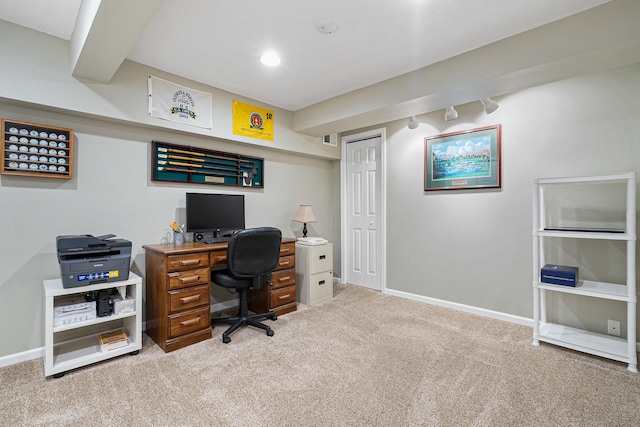 carpeted office space with baseboards and rail lighting